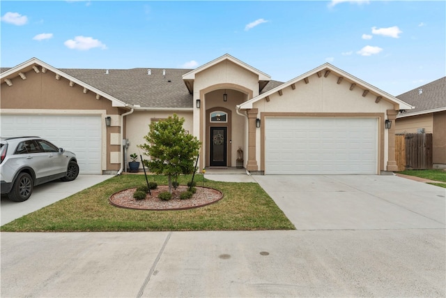 ranch-style house featuring a garage and a front yard