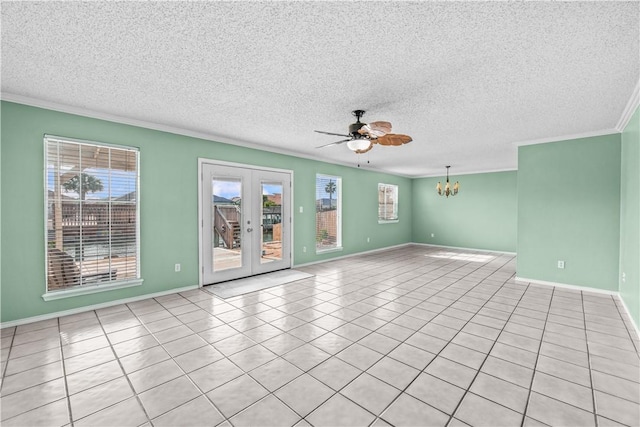 unfurnished room featuring ornamental molding, french doors, a textured ceiling, and ceiling fan with notable chandelier