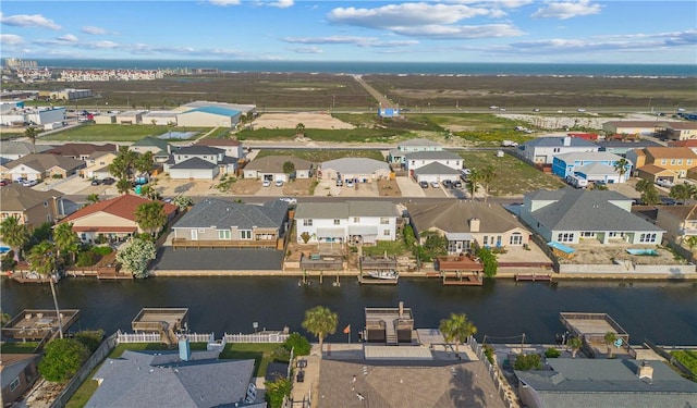 aerial view featuring a residential view and a water view