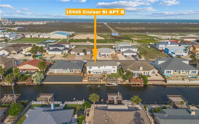 birds eye view of property featuring a residential view and a water view