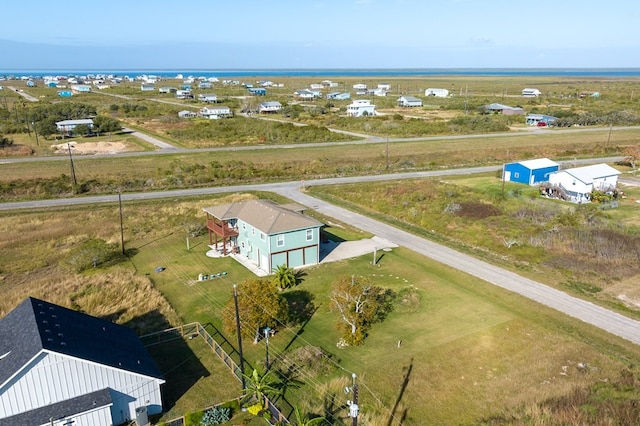 bird's eye view featuring a rural view and a water view