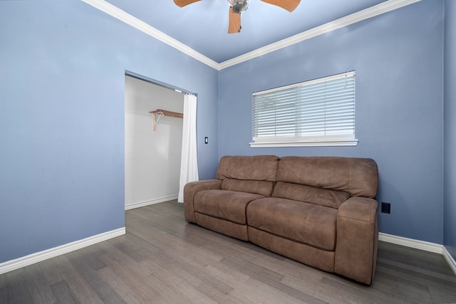 living room featuring ceiling fan, wood-type flooring, and ornamental molding