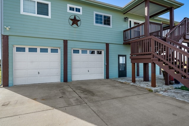 back of house featuring a garage