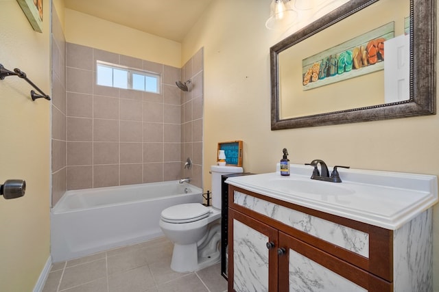 full bathroom featuring tile patterned floors, vanity, tiled shower / bath combo, and toilet