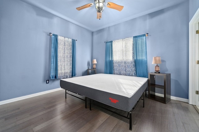 bedroom with hardwood / wood-style flooring and ceiling fan