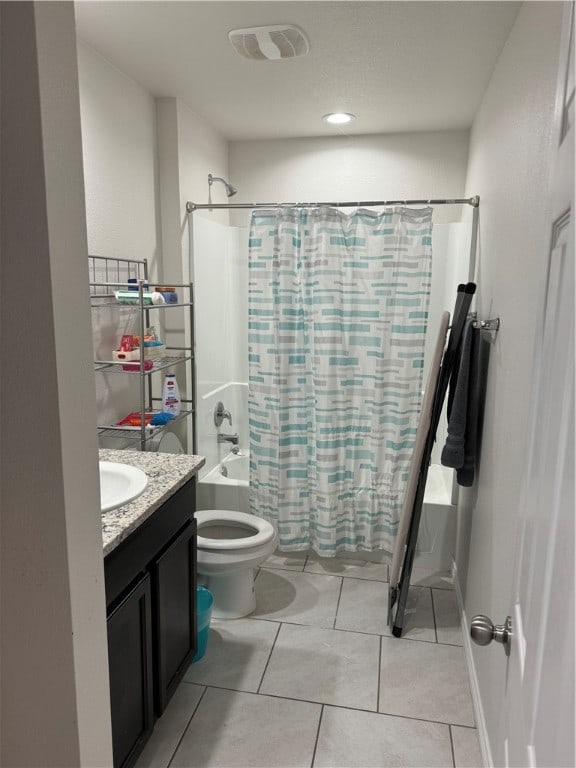 full bathroom with shower / tub combo with curtain, vanity, toilet, and tile patterned floors