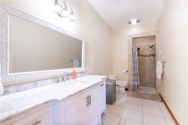 bathroom with vanity, tile patterned flooring, curtained shower, and toilet