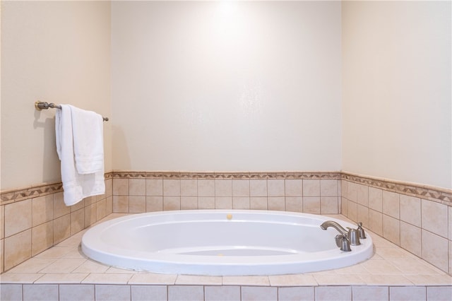 bathroom with tiled bath