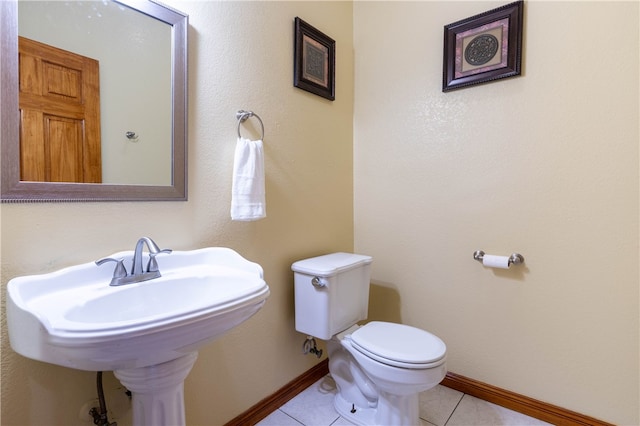 bathroom with tile patterned floors and toilet