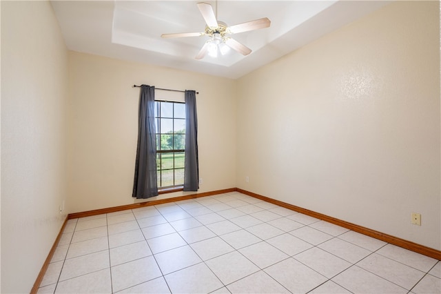 empty room featuring light tile patterned floors and ceiling fan