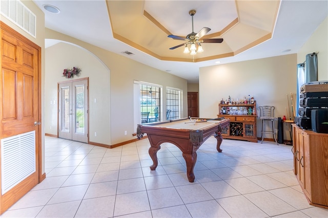 playroom featuring pool table, a healthy amount of sunlight, ceiling fan, and a tray ceiling