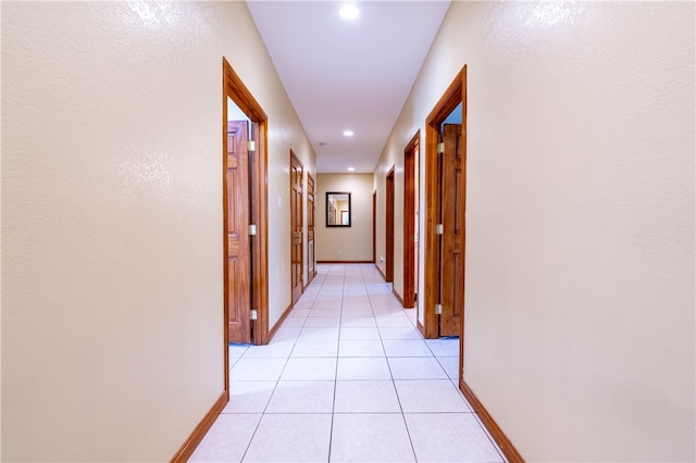 hallway with light tile patterned flooring