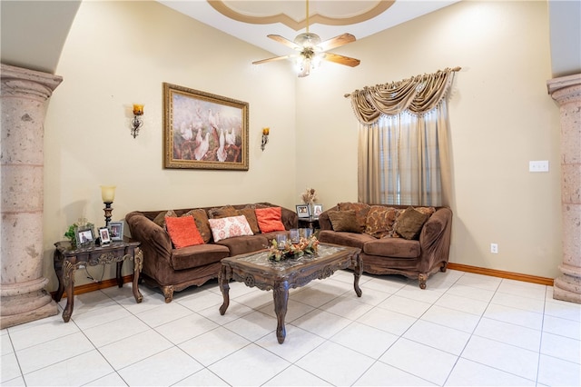 living room with ceiling fan, light tile patterned floors, and decorative columns