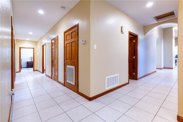 hallway featuring light tile patterned floors