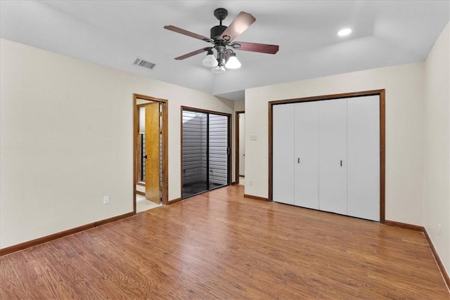 unfurnished bedroom with light wood-style floors, recessed lighting, visible vents, and baseboards