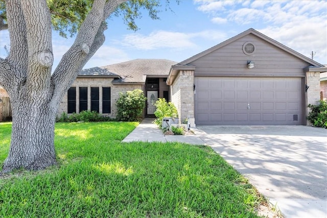 view of front of property with concrete driveway, a front lawn, and an attached garage