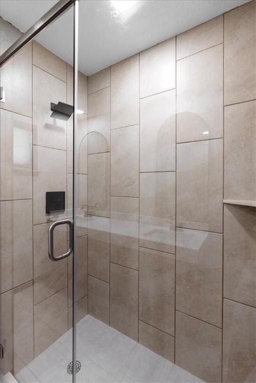 bathroom with a shower stall