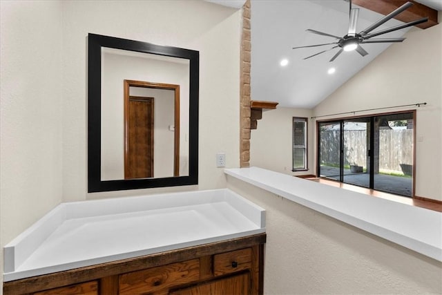 bathroom featuring vaulted ceiling and recessed lighting