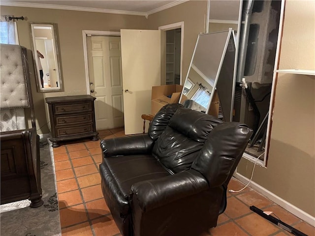 sitting room featuring tile patterned floors, baseboards, and ornamental molding