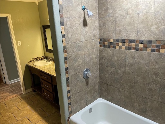 full bathroom with vanity, tub / shower combination, and baseboards