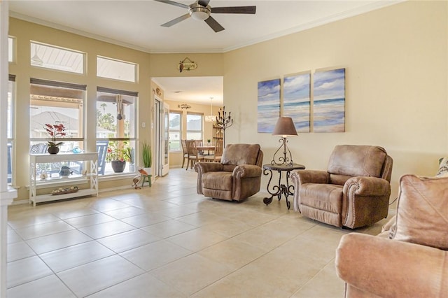913 Pompano Dr, Aransas Pass, TX 78336 - living area featuring a ceiling fan, light tile patterned floors, a chandelier, and crown molding