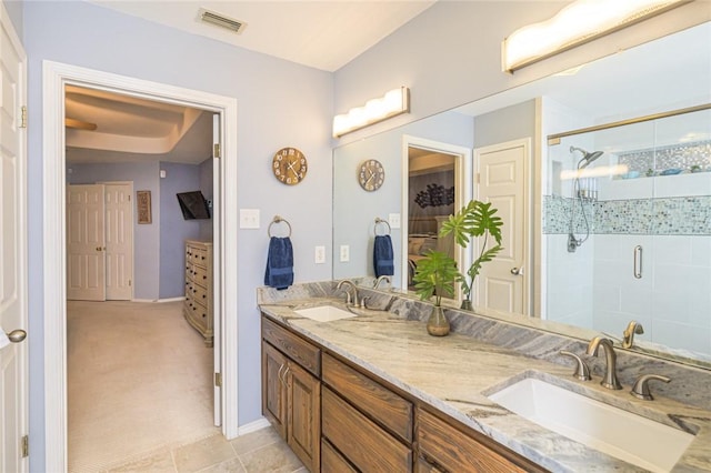 913 Pompano Dr, Aransas Pass, TX 78336 - bathroom featuring double vanity, a stall shower, and baseboards