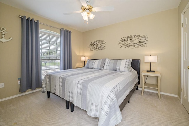 913 Pompano Dr, Aransas Pass, TX 78336 - bedroom with carpet flooring, baseboards, and ceiling fan