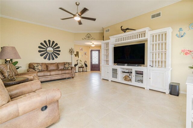 913 Pompano Dr, Aransas Pass, TX 78336 - living room featuring ceiling fan, crown molding, and light tile patterned flooring