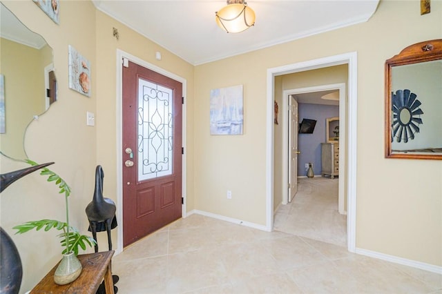 913 Pompano Dr, Aransas Pass, TX 78336 - foyer with light tile patterned floors, baseboards, and ornamental molding