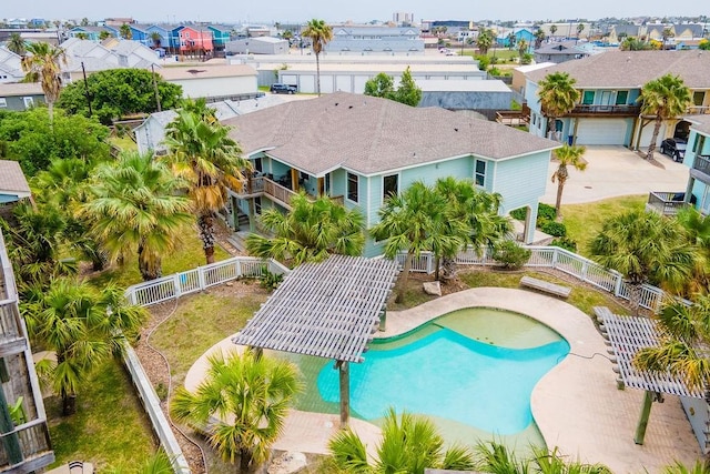 247 W Roberts Ave Unit 16, Port Aransas, TX 78373 - view of swimming pool featuring a fenced backyard and a residential view