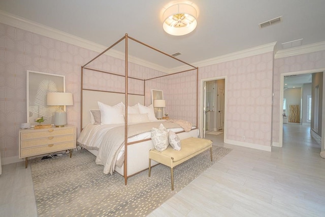 bedroom with ornamental molding, visible vents, wallpapered walls, and wood finished floors