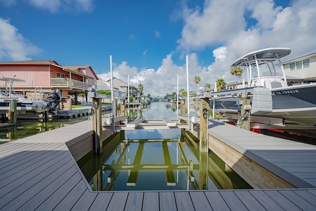 dock area with a water view and boat lift
