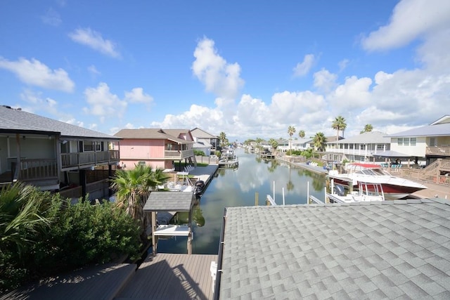 dock area with a water view and a residential view