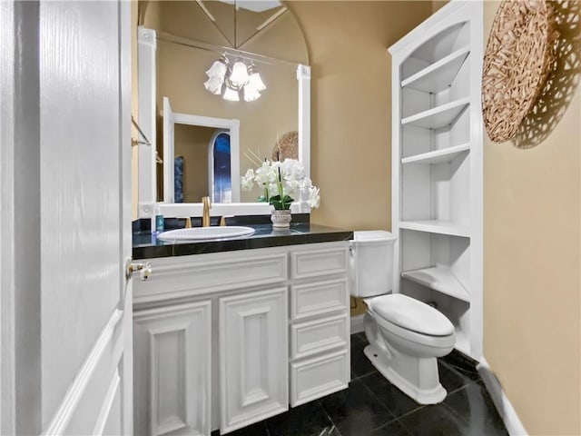 8029 Villefranche Dr, Corpus Christi, TX 78414 - bathroom featuring a chandelier, toilet, vanity, tile patterned floors, and baseboards