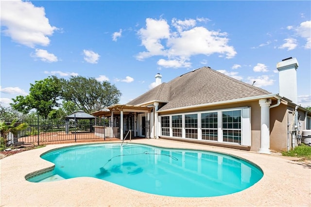 view of swimming pool featuring a gazebo and a patio area