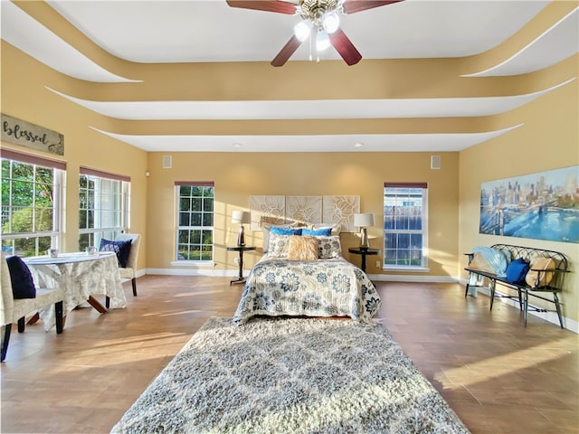 bedroom with multiple windows and ceiling fan