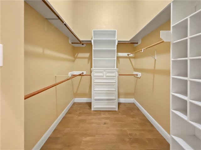 spacious closet featuring hardwood / wood-style floors