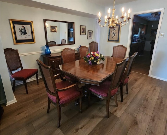 6421 Oakbrook Dr, Corpus Christi, TX 78413 - dining area featuring baseboards, wood finished floors, and an inviting chandelier