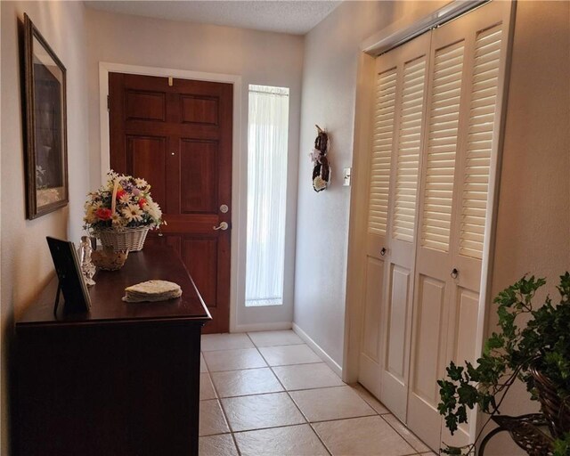 6421 Oakbrook Dr, Corpus Christi, TX 78413 - entryway featuring light tile patterned floors and baseboards