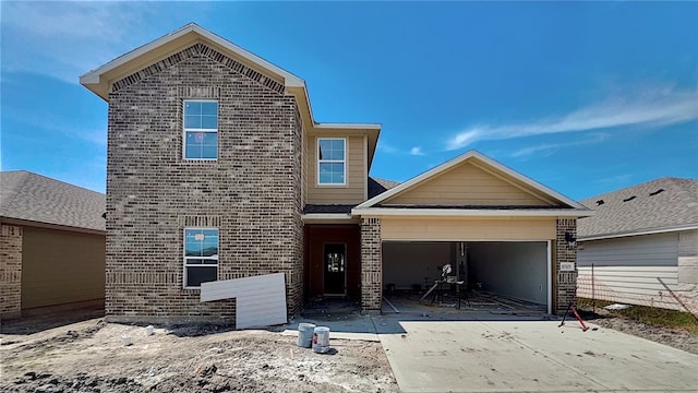 10325 Stone Creek Dr, Corpus Christi, TX 78410 - traditional-style house featuring brick siding, a garage, and driveway