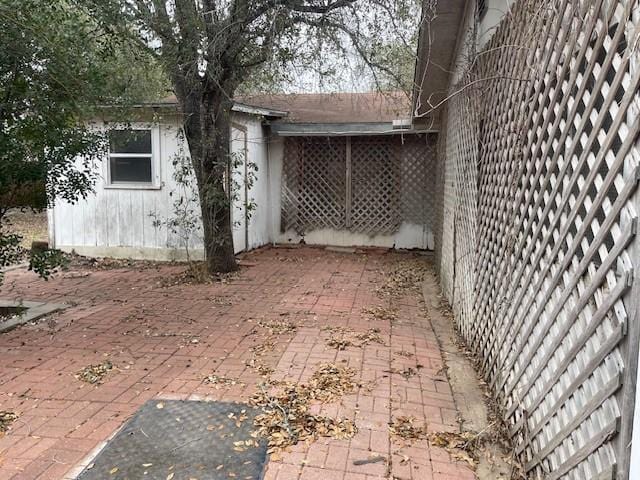 view of property exterior with a patio