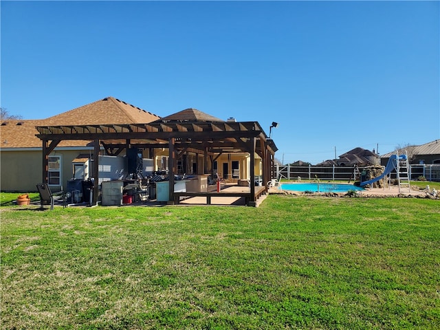 back of property featuring a pergola, a patio area, and a yard