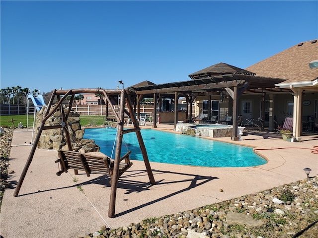 view of pool with an in ground hot tub and a patio area