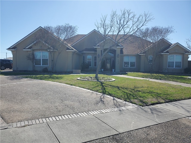 single story home featuring a front yard