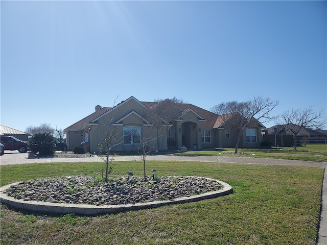 ranch-style home with a front yard