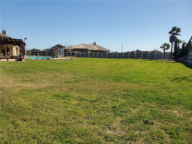 view of yard featuring a fenced in pool, a pergola, and a patio