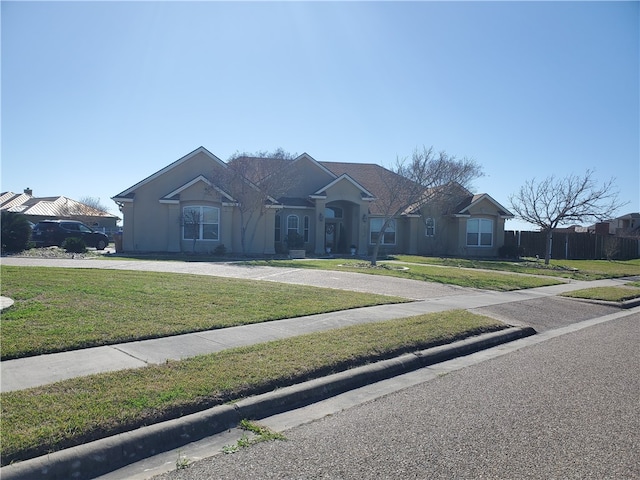 single story home with a front lawn