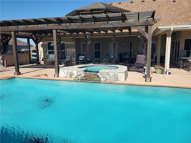 view of pool featuring a patio area, a pergola, and an in ground hot tub