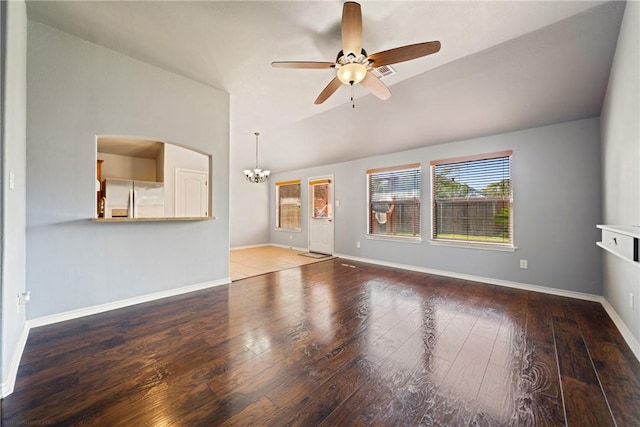 unfurnished living room featuring wood-type flooring, lofted ceiling, and ceiling fan with notable chandelier