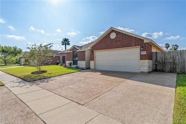 view of front of home featuring a garage and a front yard